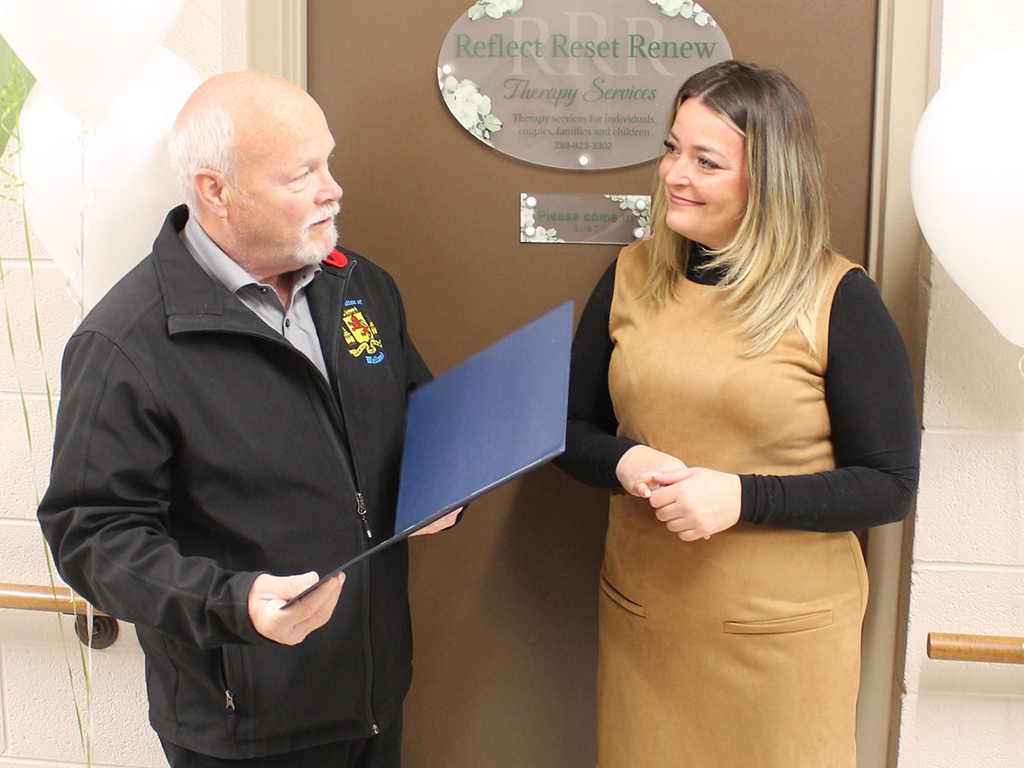 mayor campion talking to business owner