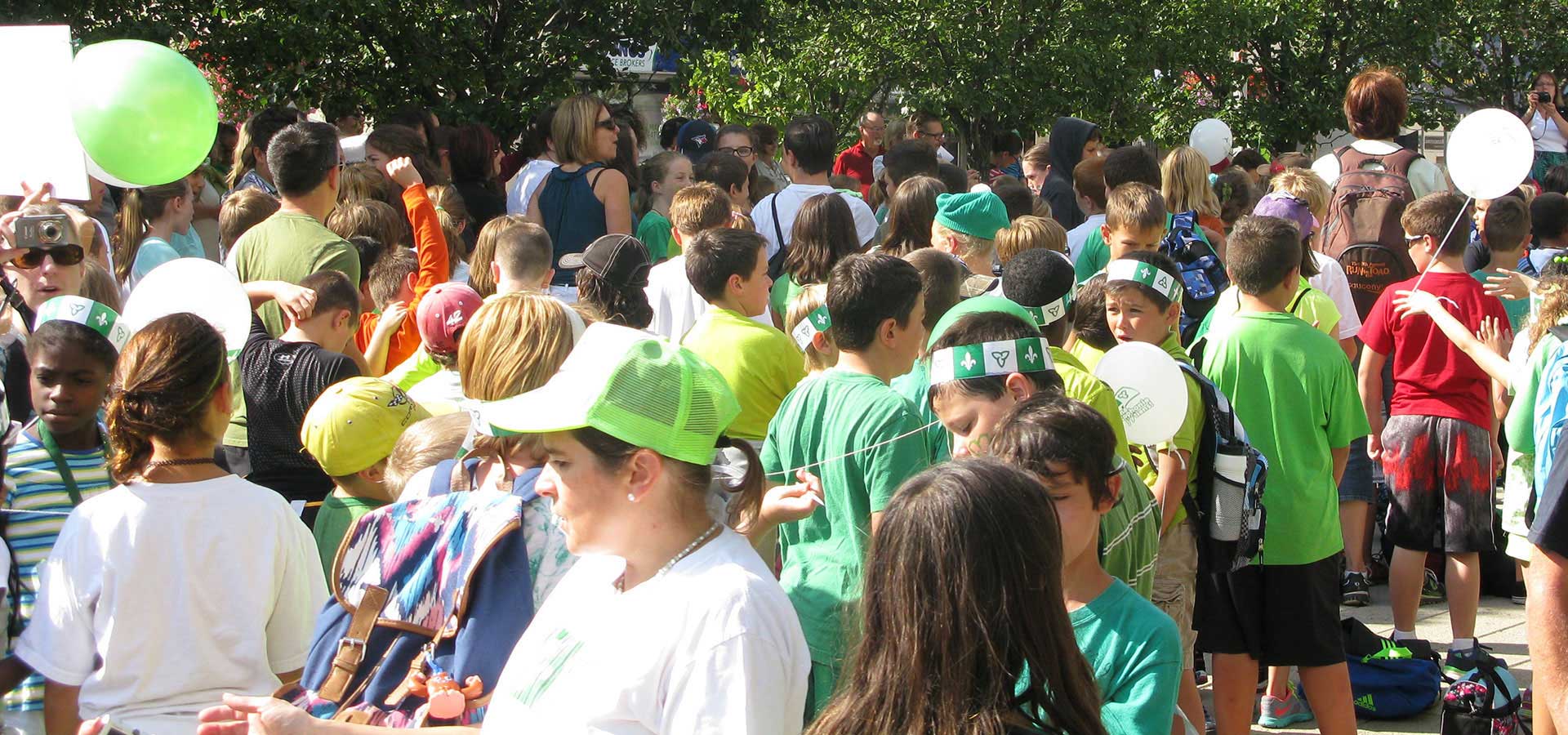 adults and children with balloons