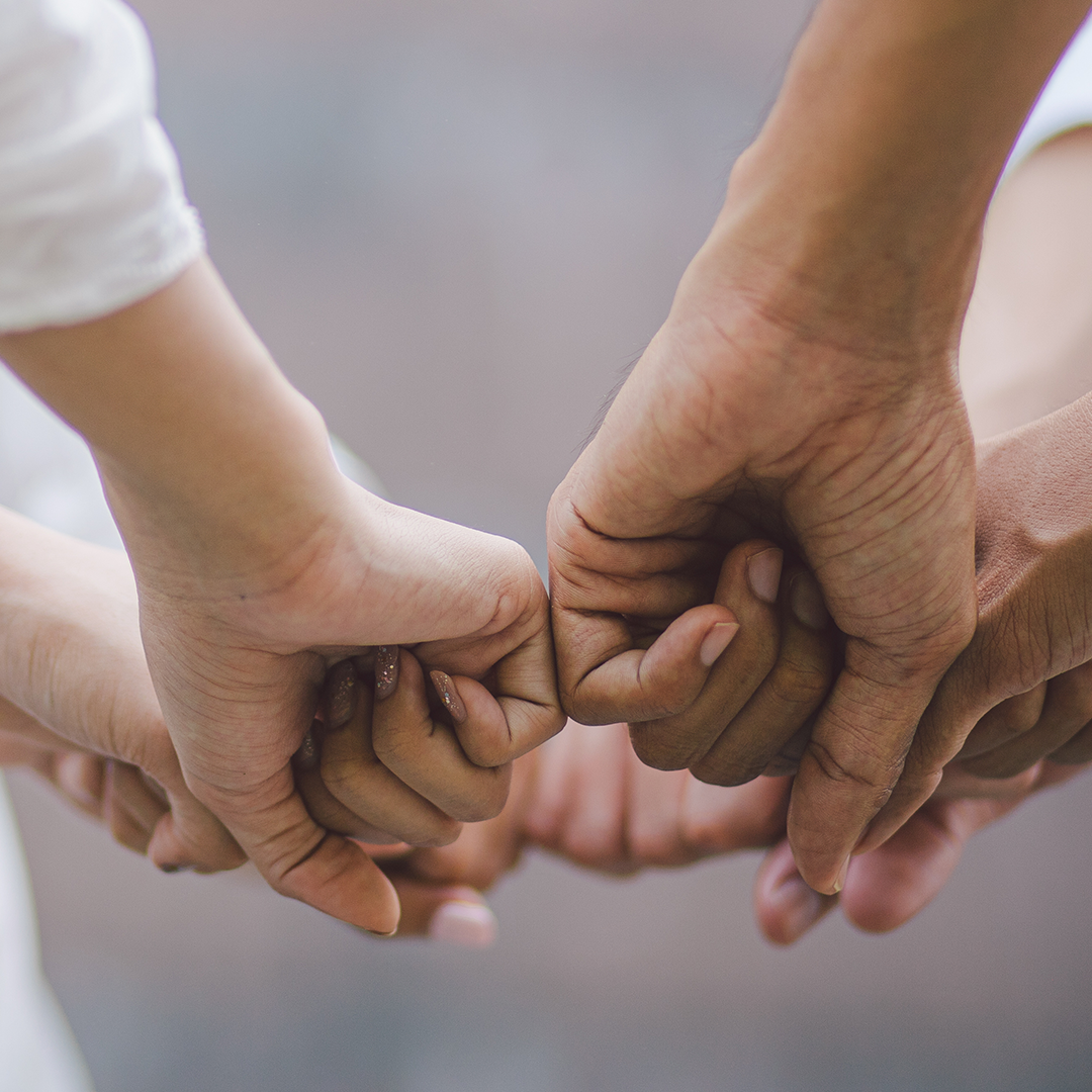 people touching hands