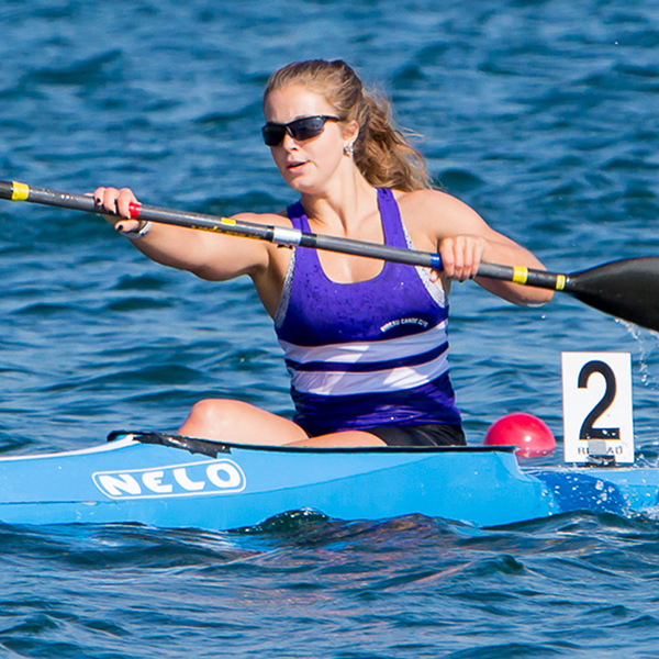 woman using a kayak on the waterway