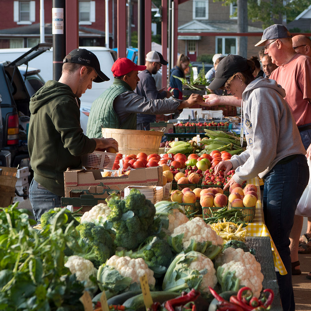 image of outside market vendors and patrons 