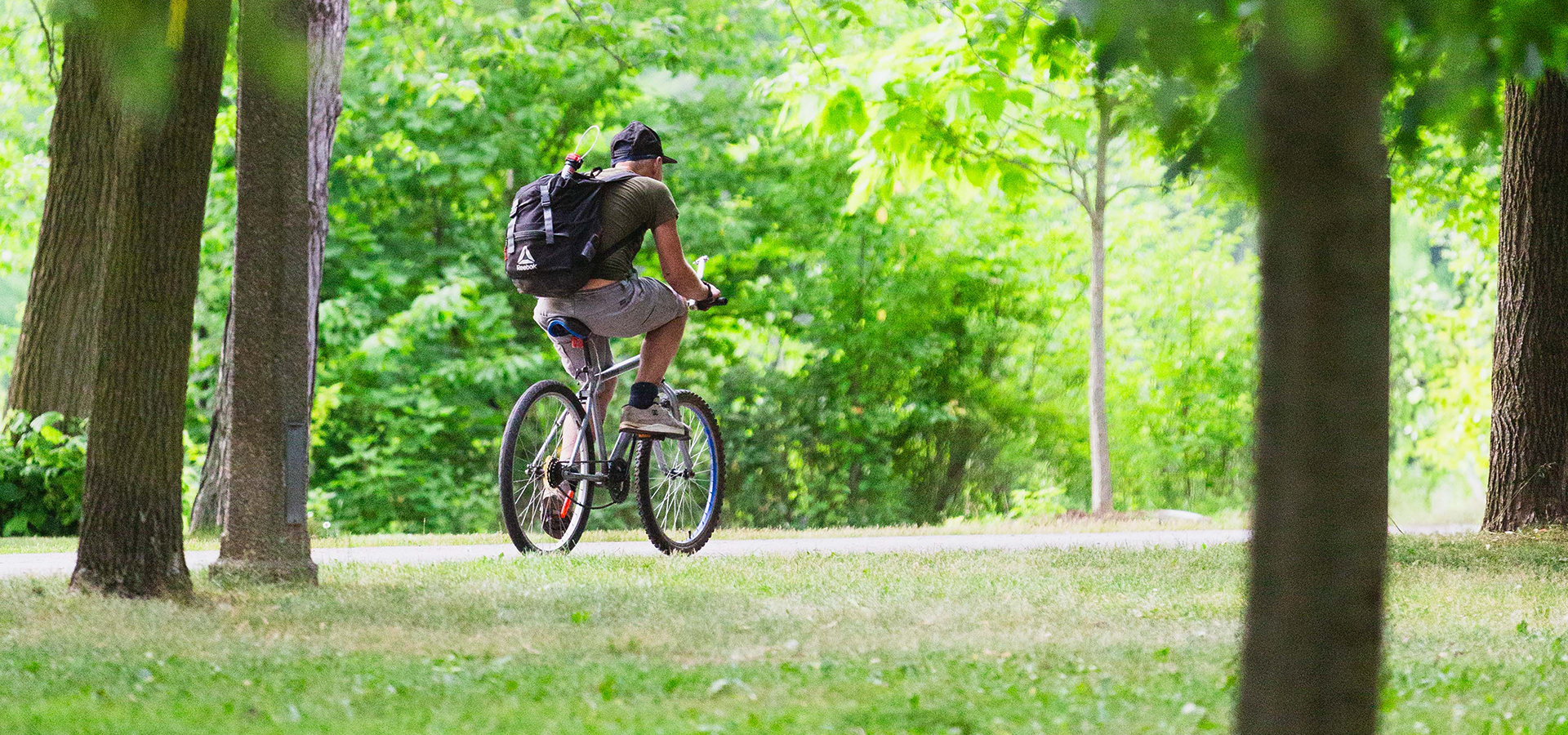 person riding a bike on a scenic trail