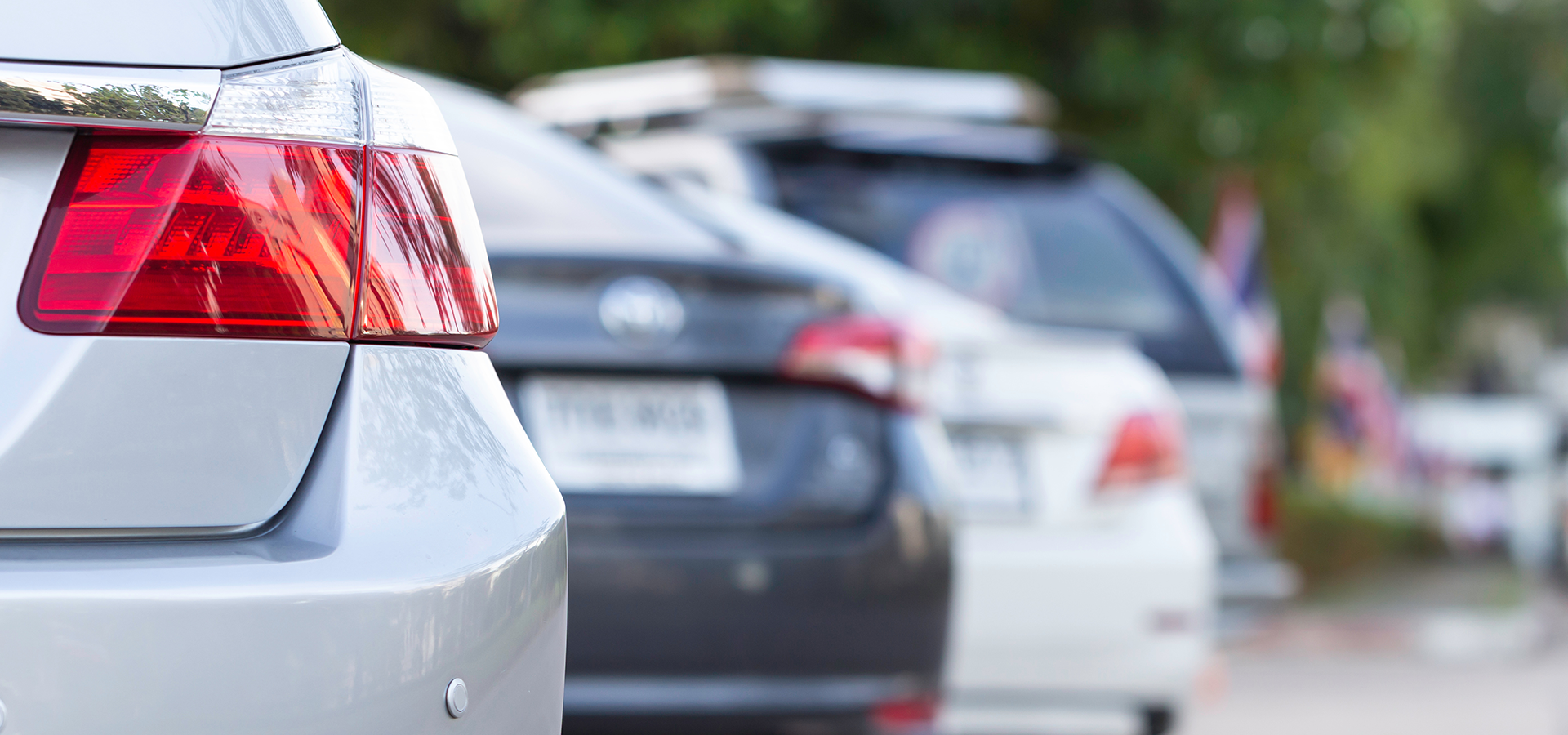 close up of cars parked in a parking log