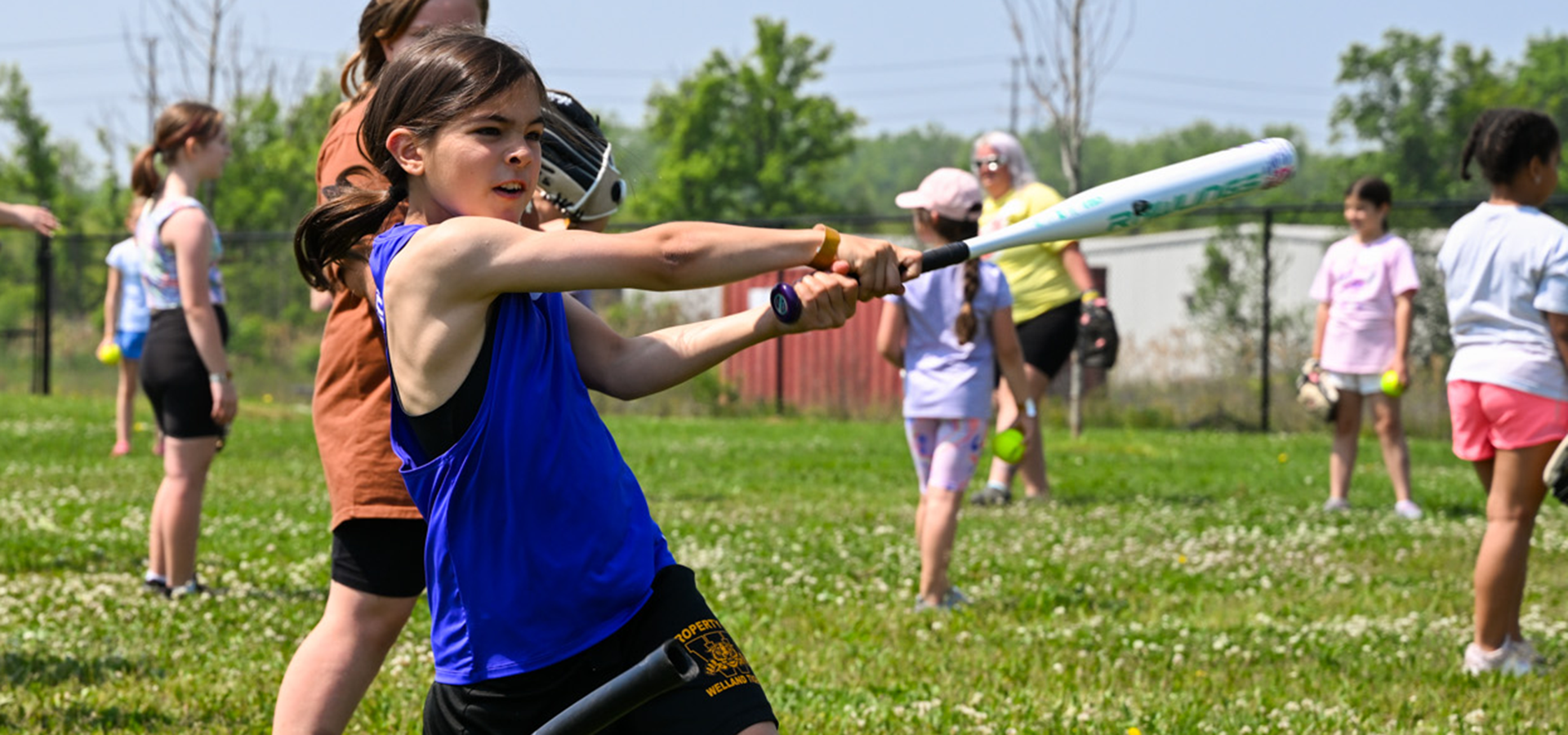 Group of youngs girls playing baseball