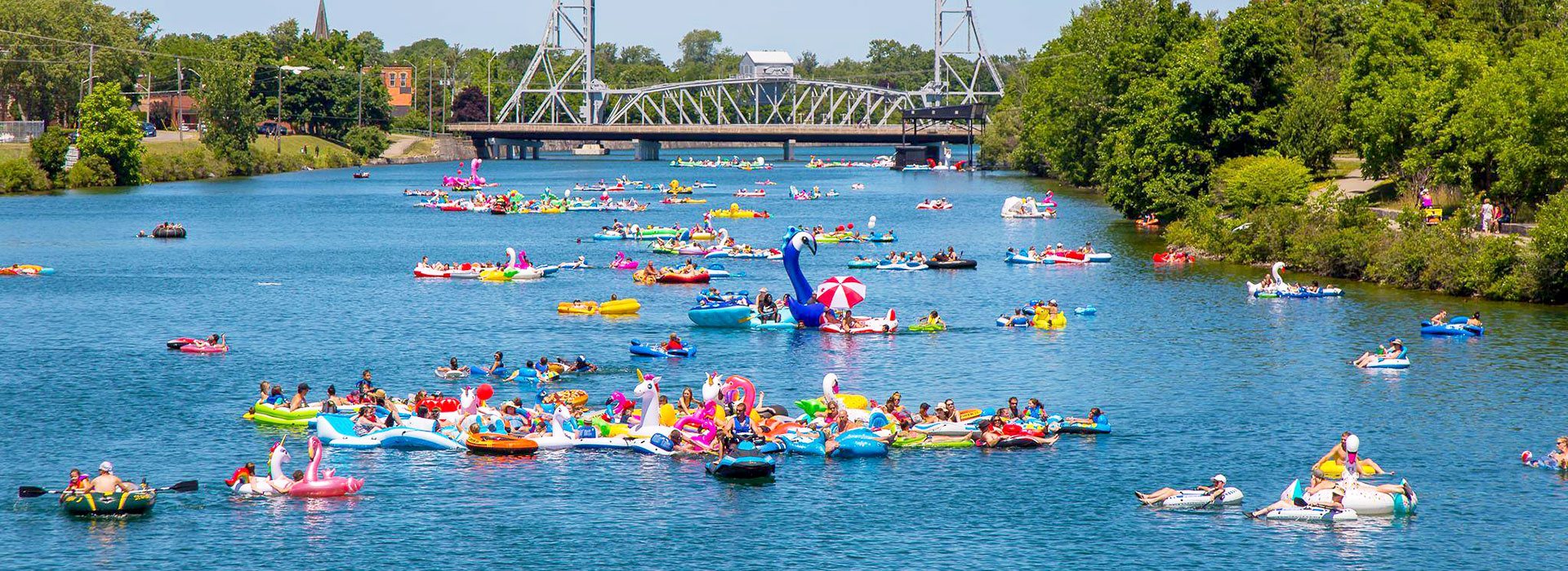 people floating on the waterway