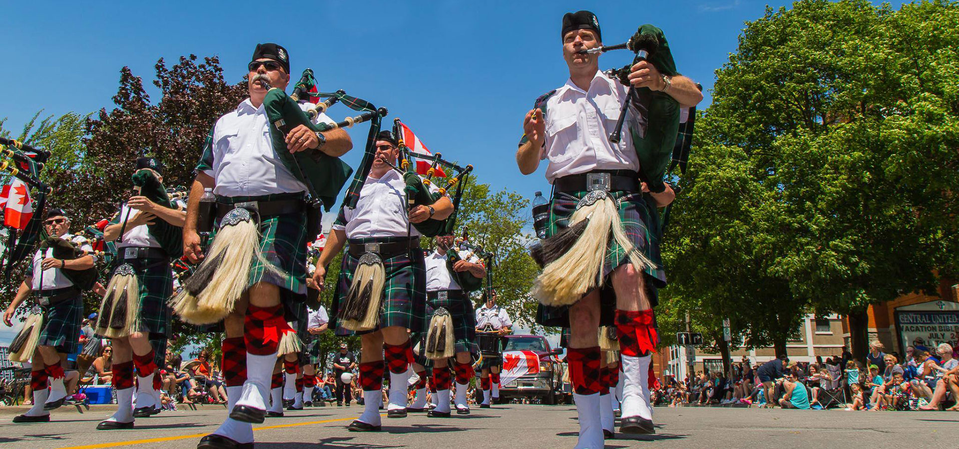 men marching playing the bag pipes