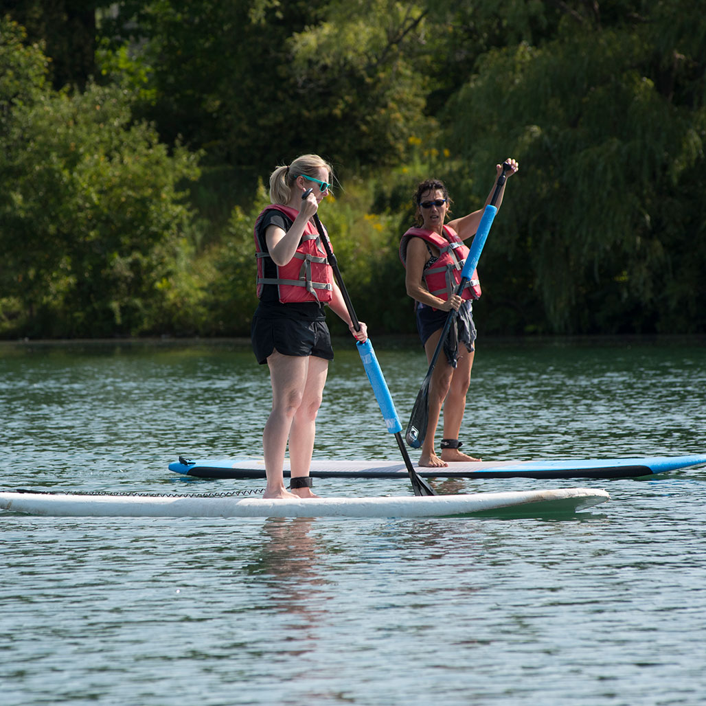 image of 2 stand up paddleboarders